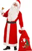 A person dressed as Santa Claus holding a bell and a gift bag. Produktbild-Vorschau