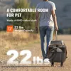 A person is walking outdoors, pulling a pet carrier on wheels. Podgląd zdjęcia produktu
