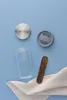 A kefir making set is laid out on a blue background with a white cloth. Náhľad obrázku produktu