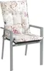 A chair cushion with a butterfly and floral pattern on a chair. Produktbild-Vorschau