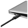 A close-up shot of a black USB-C cable plugged into a silver laptop. Náhľad obrázku produktu