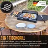 An electric grill is set up on a wooden table outdoors, with food and plates around it. Produktbild-Vorschau