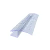A clear plastic shower door seal with water droplets on it, shown at an angle against a white background. Podgląd zdjęcia produktu
