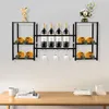 A wall-mounted wine rack with bottles and glasses, displayed in a home or showroom setting. Podgląd zdjęcia produktu
