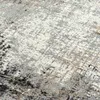 A close-up, textured view of a rug with abstract patterns. Produktbild-Vorschau