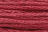 A close-up view of red embroidery thread. Produktbild-Vorschau