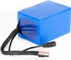A blue battery pack with wires and connectors on a white background. Anteprima dell’immagine prodotto