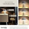 A collage of images showing a table lamp with its features and different lighting settings. Náhled obrázku produktu