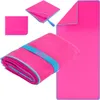 A collage of images showing a pink microfiber towel in different states: folded with a blue strap, unfolded, and a close-up of a corner. Produktbild-Vorschau