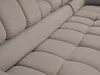 A close-up view of a tufted sofa. Produktbild-Vorschau