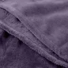 A close-up view of a folded purple blanket, showing the texture of the fabric. Anteprima dell’immagine prodotto