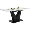 A modern dining table with a white marble-effect tabletop and a black V-shaped base. Anteprima dell’immagine prodotto