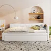 A white daybed with bedding and pillows is set up in a room with a curved wall niche and shelves. Náhled obrázku produktu