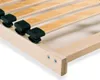 Close-up view of a wooden bed slatted frame with black plastic holders. Produktbild-Vorschau