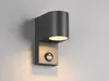 A modern gray outdoor wall light with a motion sensor is mounted on a light gray wall. Produktbild-Vorschau