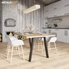 A dining set in a rustic modern home with a fireplace. Voir les images du produit
