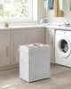 A laundry room scene with a washing machine, cabinets, and a laundry basket. Produktbild-Vorschau