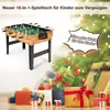 A foosball table is shown in front of a Christmas tree with gifts underneath. Text overlays highlight the product and its suitability for children. Podgląd zdjęcia produktu