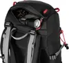 A close-up view of a black backpack, showing a zippered pocket with a flashlight and keys inside. Anteprima dell’immagine prodotto