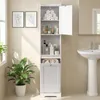 A white bathroom cabinet with open shelves and a closed cabinet door, next to a sink and a plant. Voir les images du produit