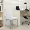 A white chair is placed in front of a desk with a laptop and a lamp. Anteprima dell’immagine prodotto