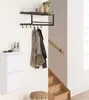 A hallway with a shoe cabinet, coat rack, and stairs. Podgląd zdjęcia produktu