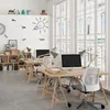 A modern office space with multiple desks and computers, illuminated by natural light from large windows. Produktbild-Vorschau
