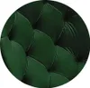 A close-up of a tufted green fabric, likely upholstery. Náhľad obrázku produktu