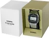 A Casio Vintage watch is presented in its packaging, with the watch inside a gold-colored insert and the white outer box beside it. Podgląd zdjęcia produktu