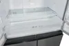Interior view of an empty refrigerator with shelves and drawers. Produktbild-Vorschau