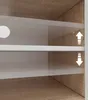 Close-up view of shelves in a TV lowboard, showing adjustable shelf height indicators. Produktbild-Vorschau