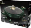 The image shows the packaging for a Berlinger Haus Emerald collection shallow pot with lid. The packaging features a dark background with the product prominently displayed, along with decorative elements like faux emeralds and gold accents. Anteprima dell’immagine prodotto
