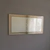 A rectangular mirror with a silver frame and a diamond-patterned glass surface hangs on a gray wall. Produktbild-Vorschau