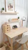 A desk setup with a wooden table, chair, and desk accessories. Anteprima dell’immagine prodotto