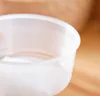 A close-up shot of a transparent plastic container with ribbed sides. Náhled obrázku produktu
