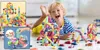 A young boy is happily playing with magnetic building blocks on the floor, surrounded by small toy cars. The image includes inset close-ups of the building blocks. Náhled obrázku produktu