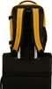 The back of a yellow and black backpack is shown attached to a black rolling suitcase. Produktbild-Vorschau
