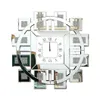A decorative wall clock with a mirrored frame and Roman numerals. Anteprima dell’immagine prodotto