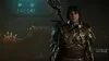 A character from Diablo IV stands in a dimly lit, ornate room with candles and stained glass windows. Produktbild-Vorschau