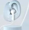 A white wired earbud is shown inserted into a stylized, light blue ear model, resting on a light blue cylindrical stand. Voir les images du produit