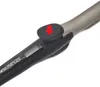 Close-up of a black and silver curling iron with a red arrow pointing down on a black button. Produktbild-Vorschau