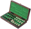 An open wooden chess set with pieces arranged on the board. Anteprima dell’immagine prodotto