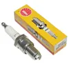 A spark plug and its packaging are shown against a white background. Náhľad obrázku produktu