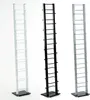 Three tall, thin CD racks in white, black, and silver displayed side-by-side against a white background. Produktbild-Vorschau