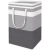 A striped laundry basket with handles. Produktbild-Vorschau