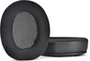 Two black ear pads for headphones are shown against a white background. One ear pad is shown from the front, and the other is shown from the side. Produktbild-Vorschau