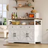 A white buffet sideboard with a wooden top, set against a white paneled wall, with shelves above displaying kitchen items and a window to the left showing a garden view. Podgląd zdjęcia produktu
