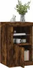 A close-up view of a wooden cabinet with decorative items on top. Produktbild-Vorschau