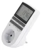 A white digital timer with a European plug and socket. Produktbild-Vorschau