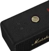 A close-up view of the top surface of a black Marshall speaker with brass accents. Produktbild-Vorschau